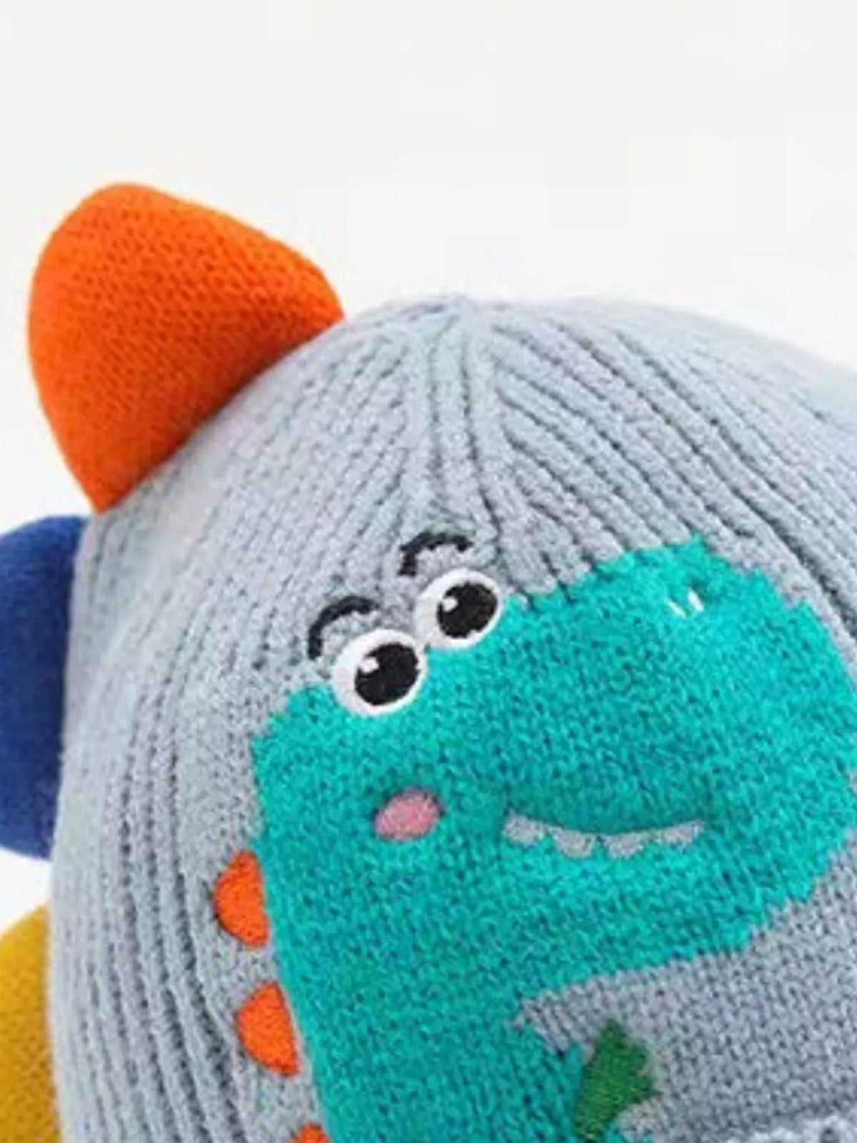 Dinosaur Knit Hat with Earflaps — blue hat crown detail