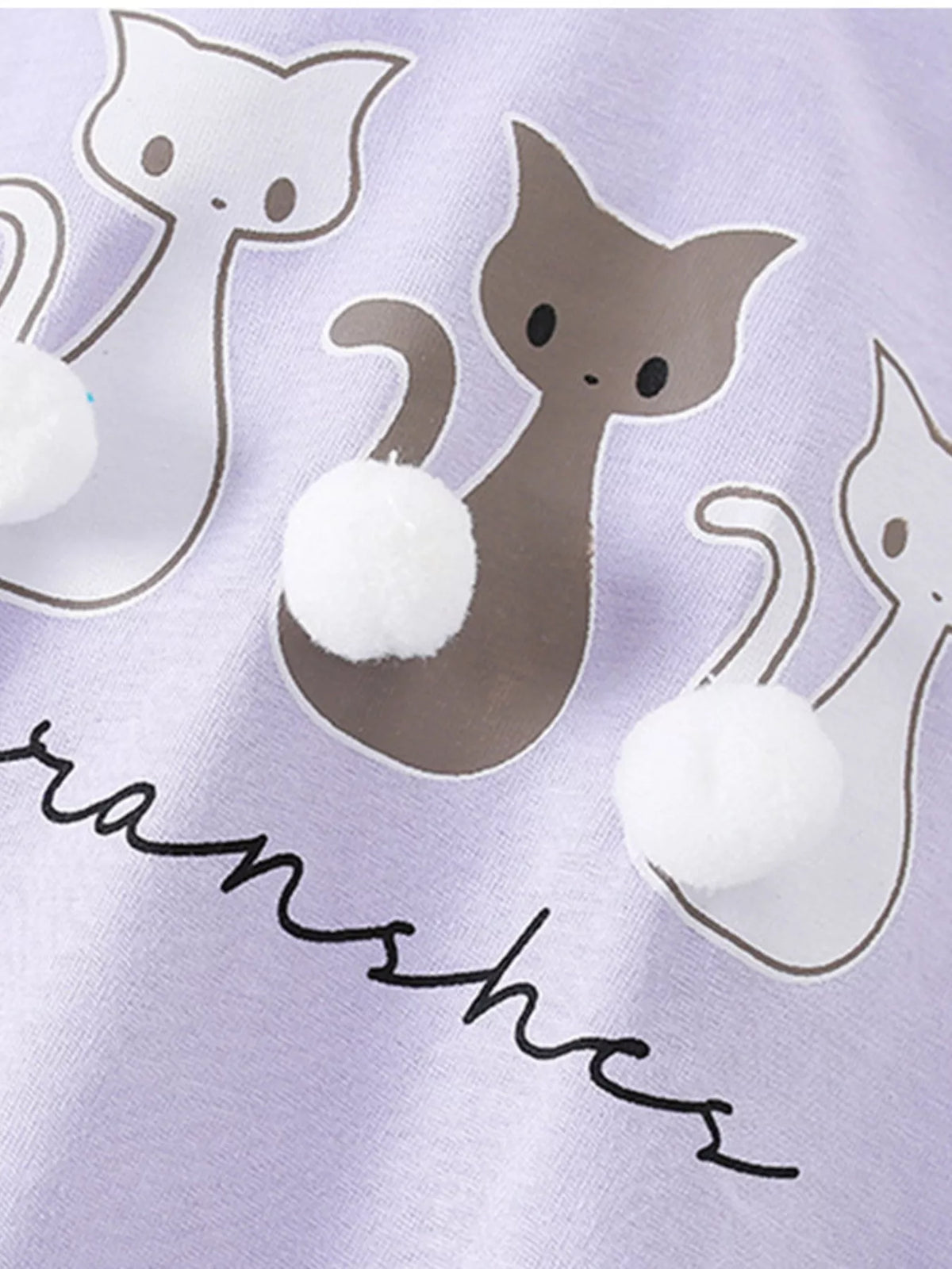 Lavender cat graphic pompom ruffle hem shirt — three cats with white pompom tails