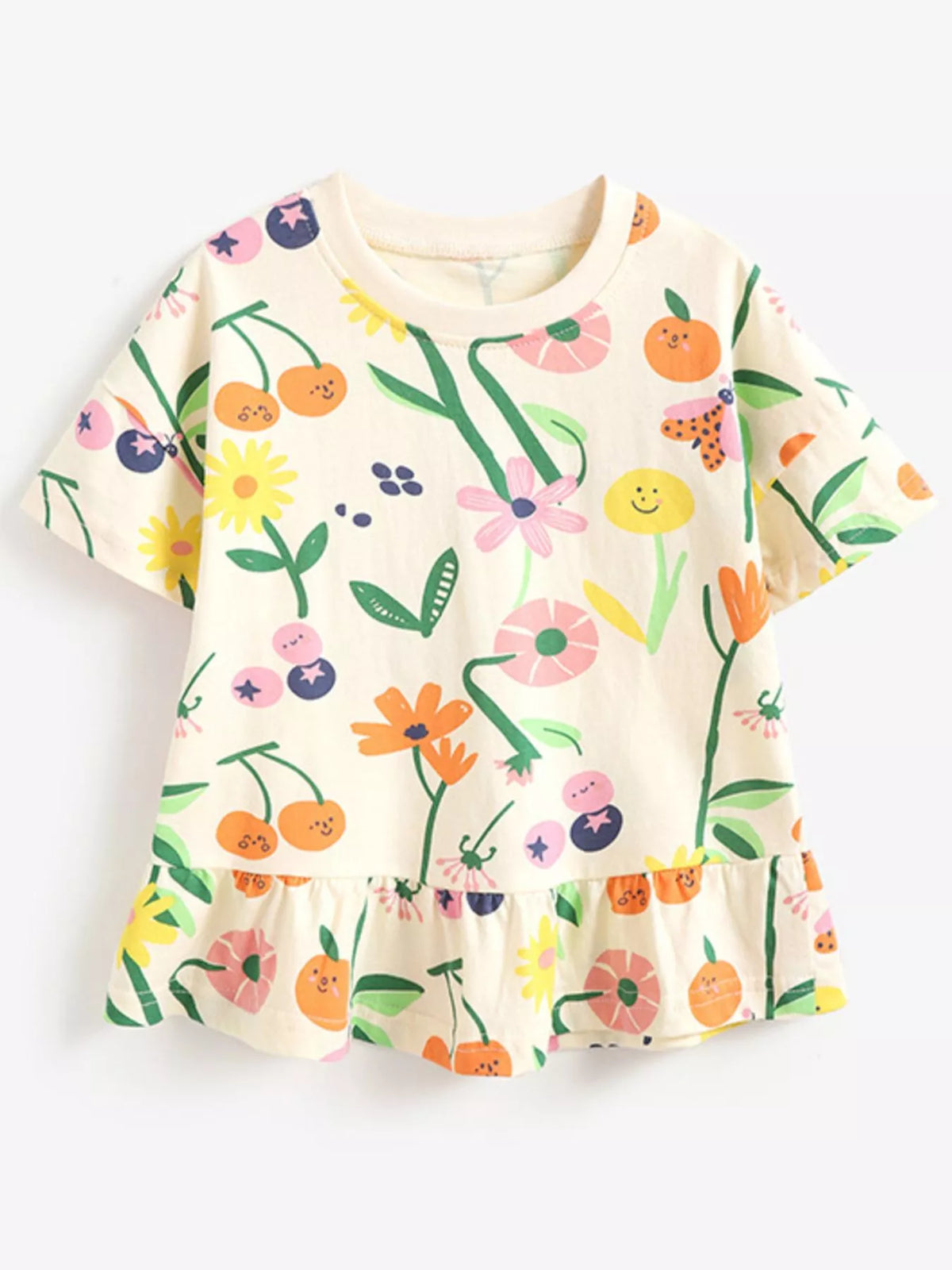 Cream floral fruit ruffle hem shirt — front laid flat
