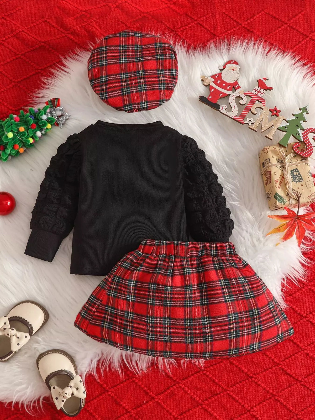 Back of the black top with red plaid skirt and hat