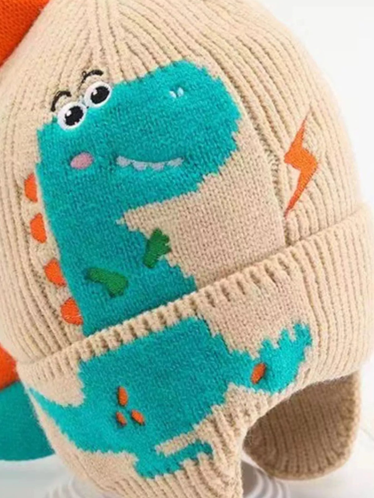 Dinosaur Knit Hat with Earflaps — beige hat front detail