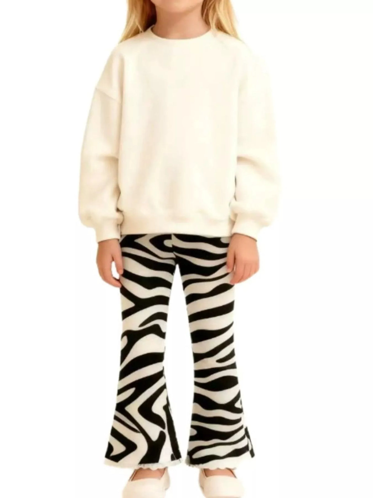 Black-and-white zebra-print flared pants on a child