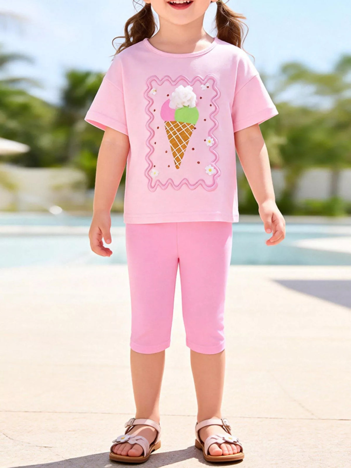 Pink ice-cream tee with pink capri leggings on a child