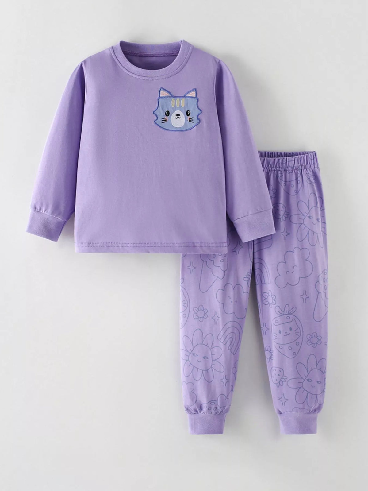 Lavender cat sweatshirt with patterned pants laid flat