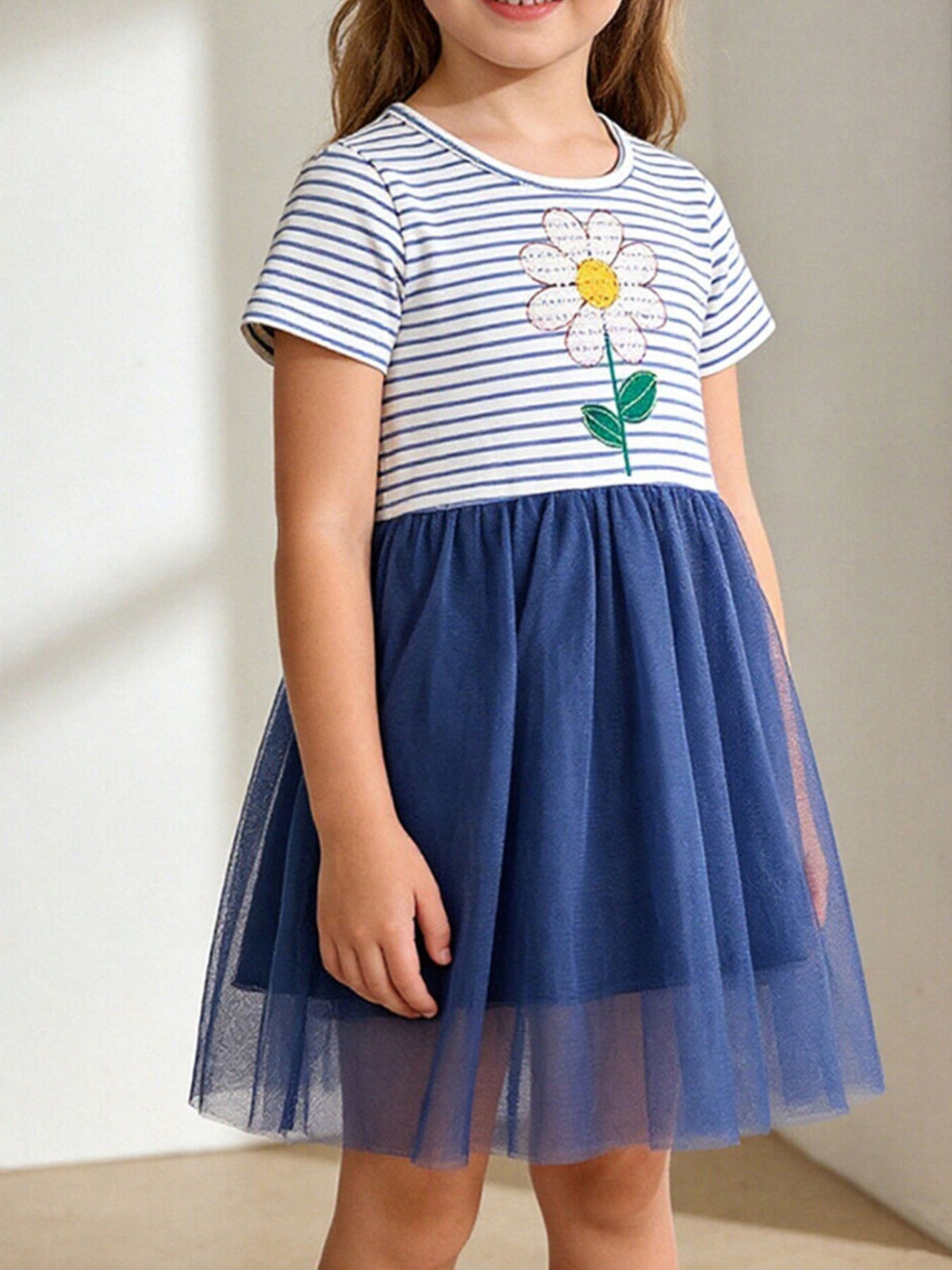 Striped Daisy Navy Tulle Dress — dress worn by a child