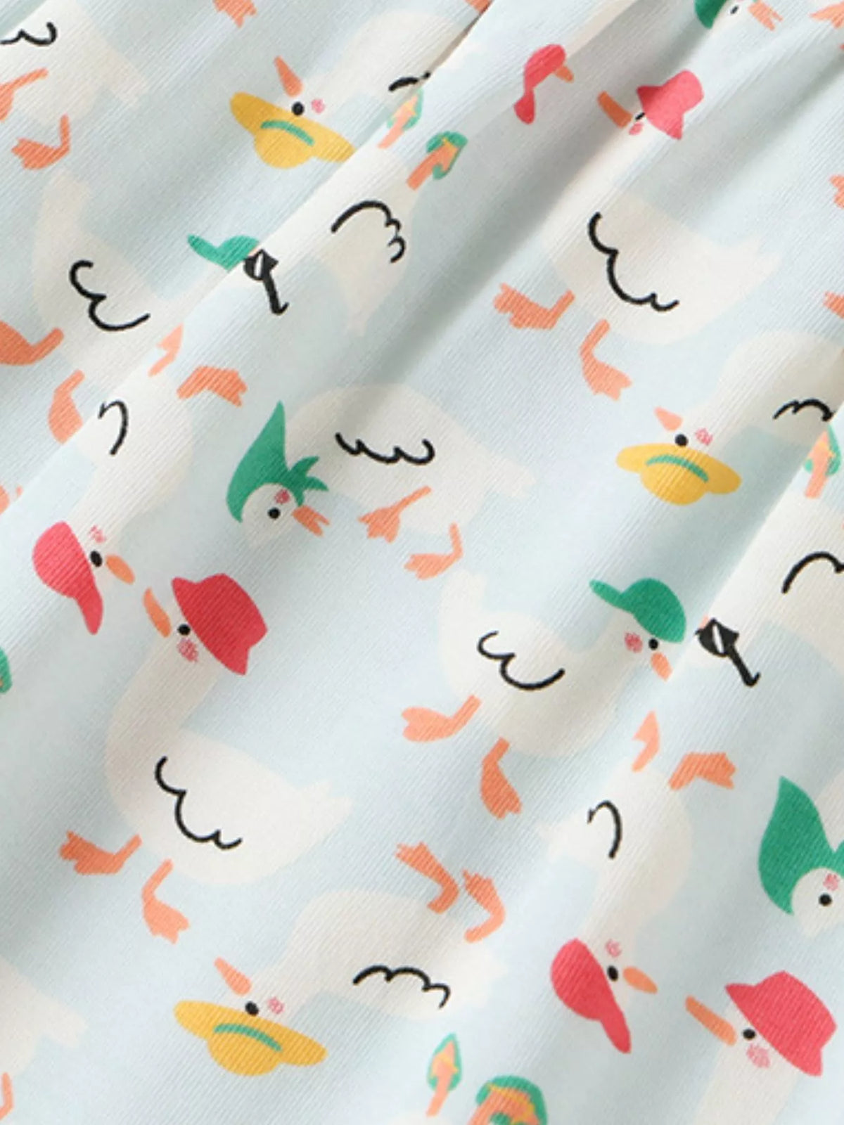 Colorful cartoon motifs on ivory fabric