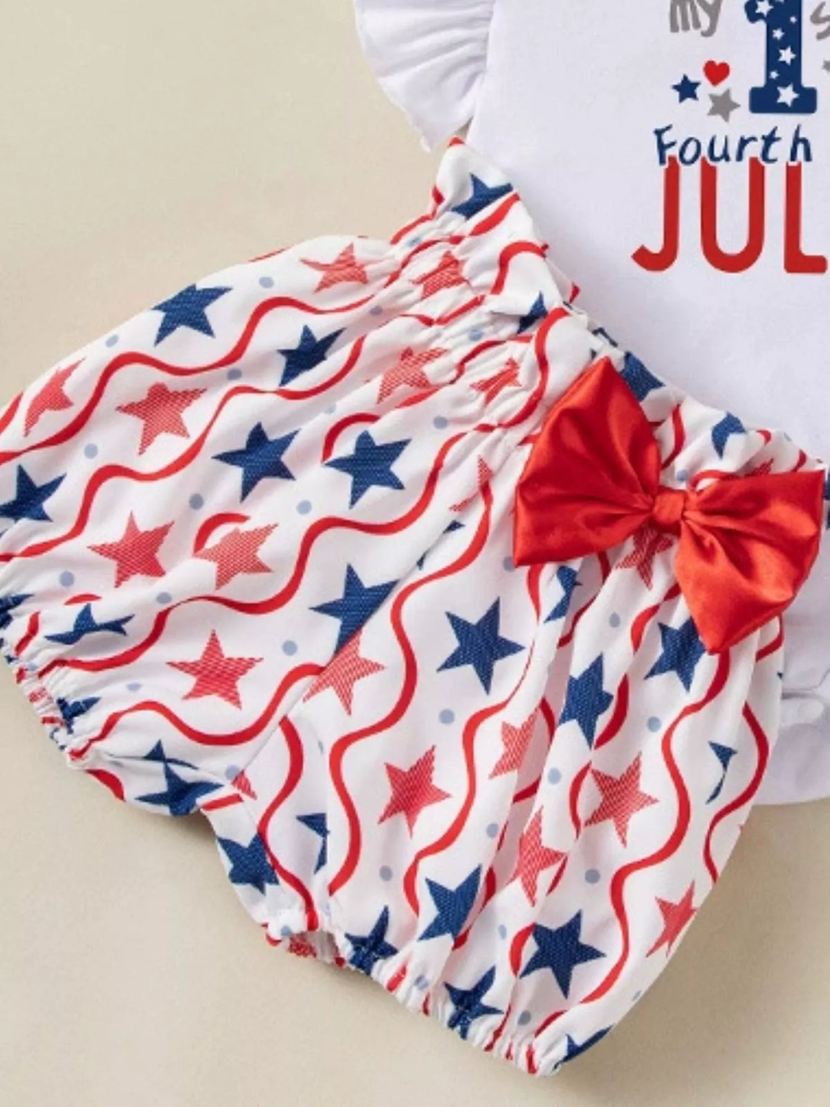 Baby Fourth of July Three-Piece Outfit Set — shorts and bow close-up