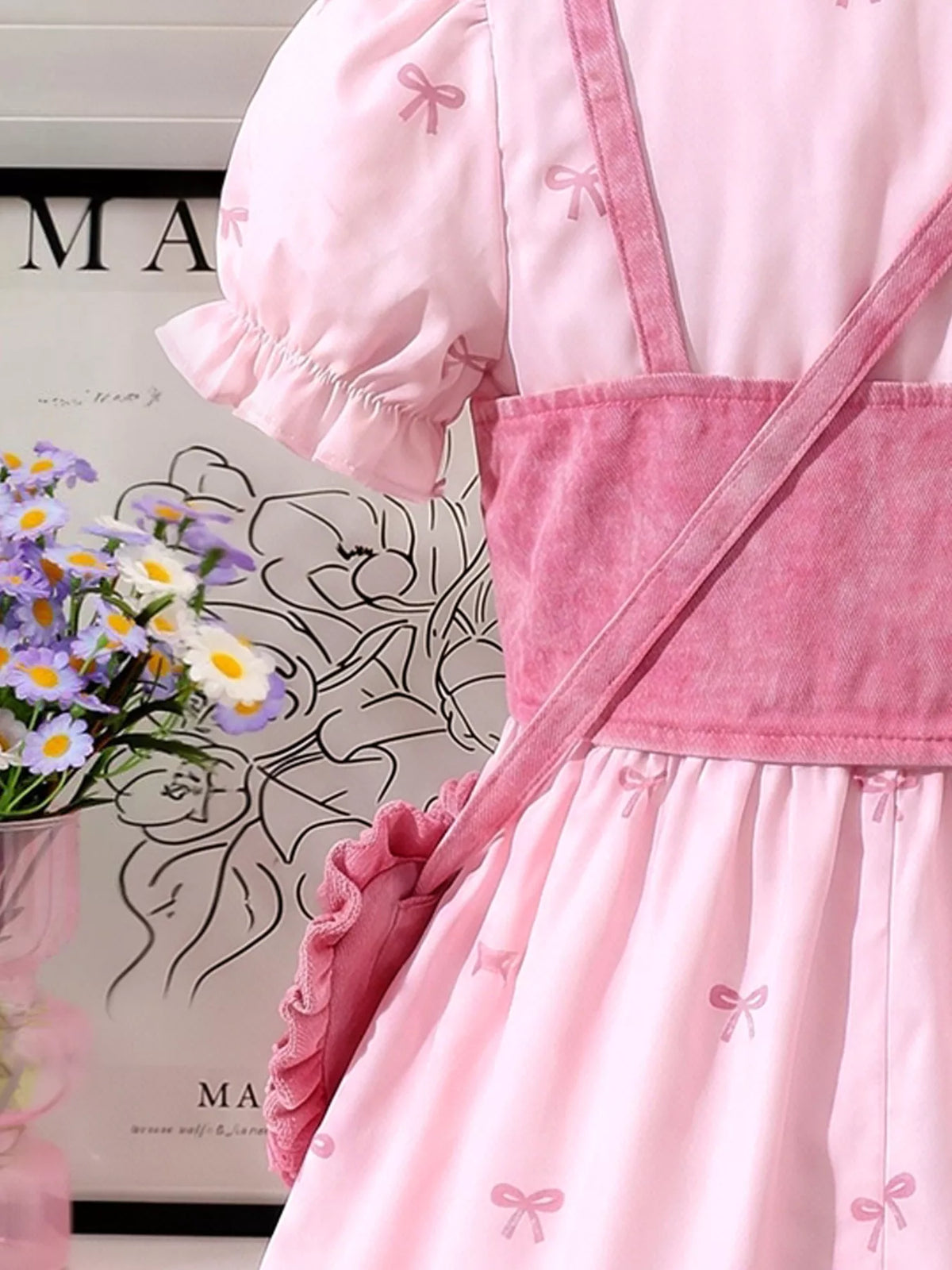 Side of the pink vest and puff sleeve