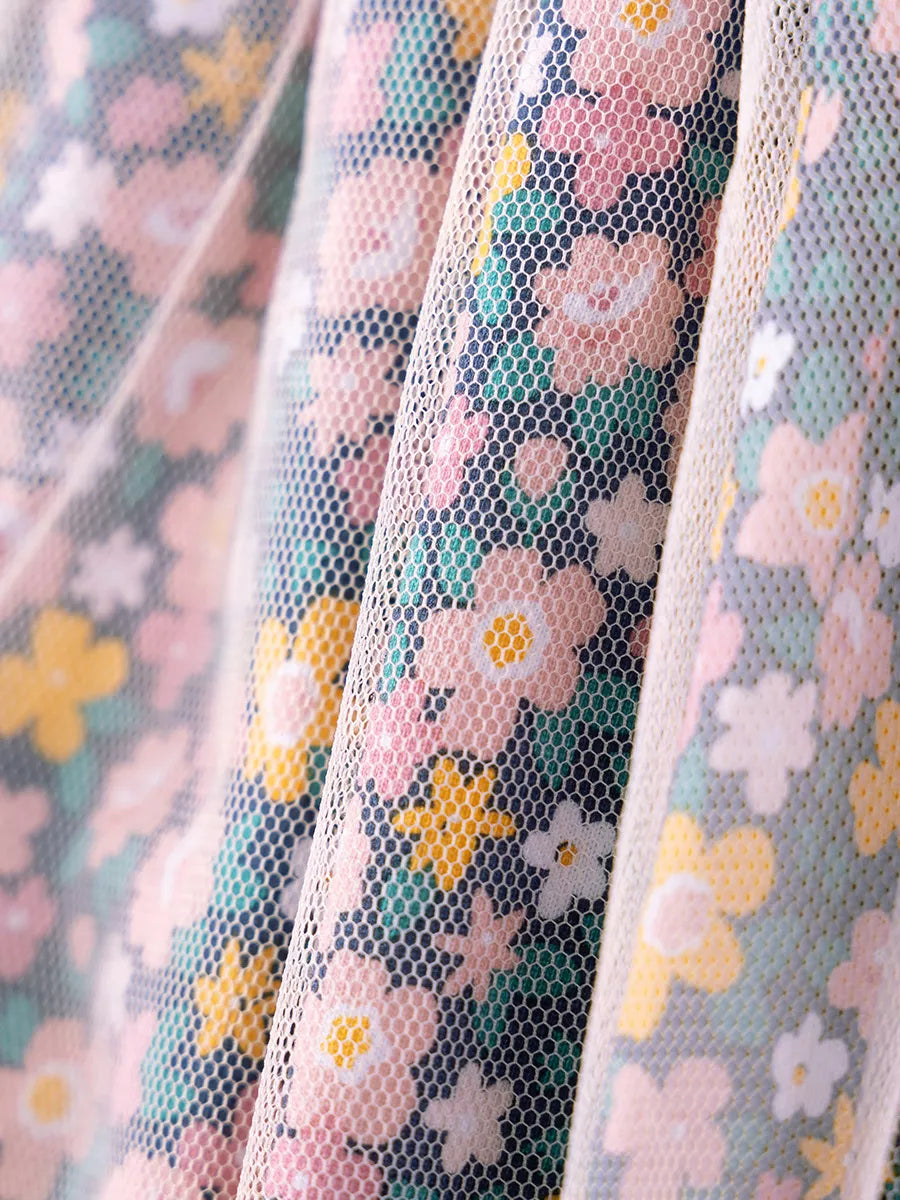 Pink and yellow flowers beneath the tulle overlay