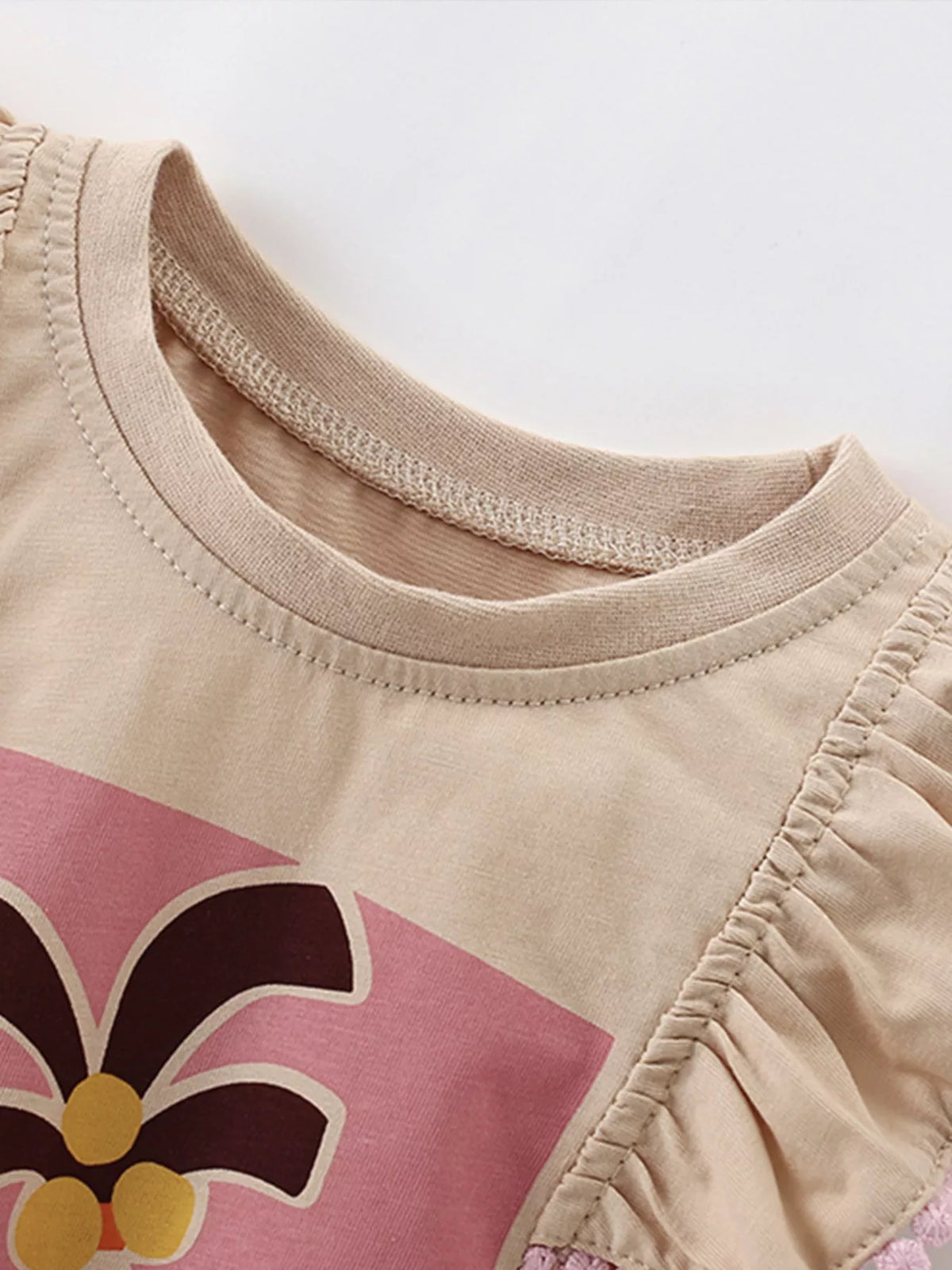 Beige palm tree graphic ruffle trim sleeveless top — round neckline