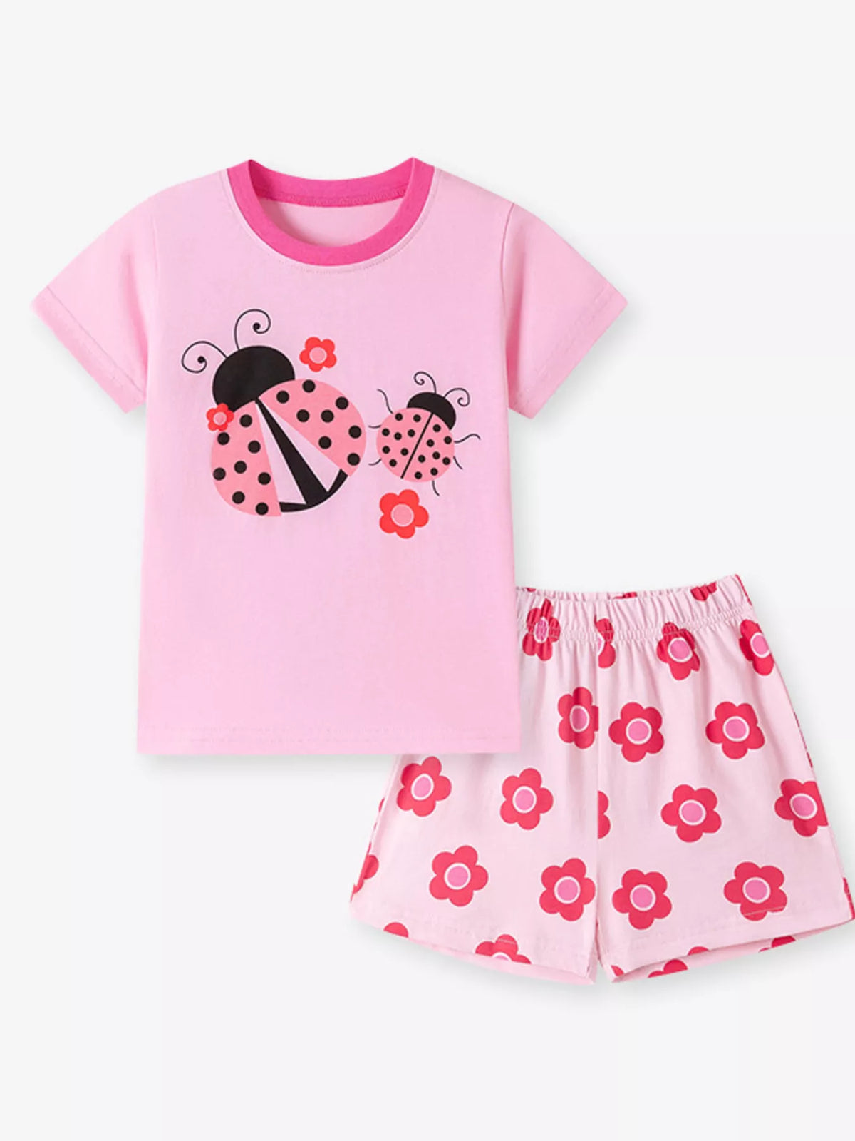Pink ladybug tee with pink floral shorts laid flat