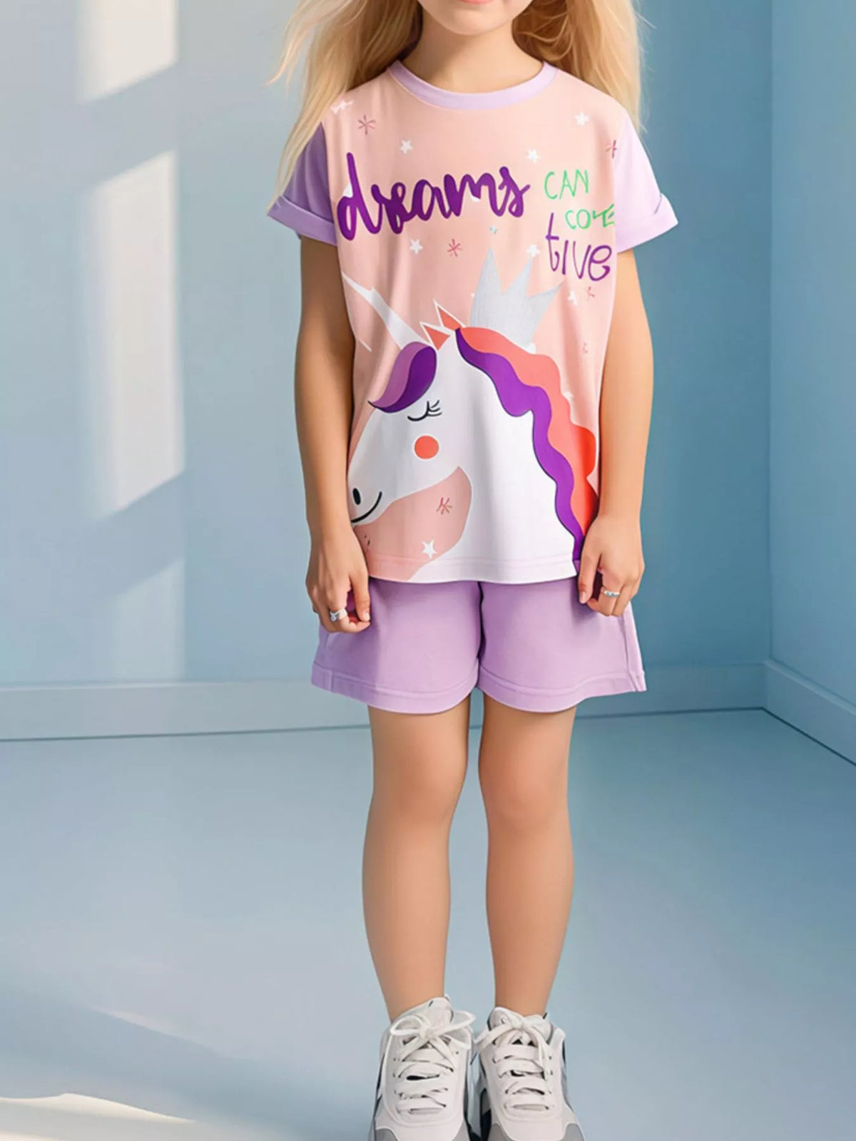 Peach unicorn tee with lavender sleeves and matching shorts on a child