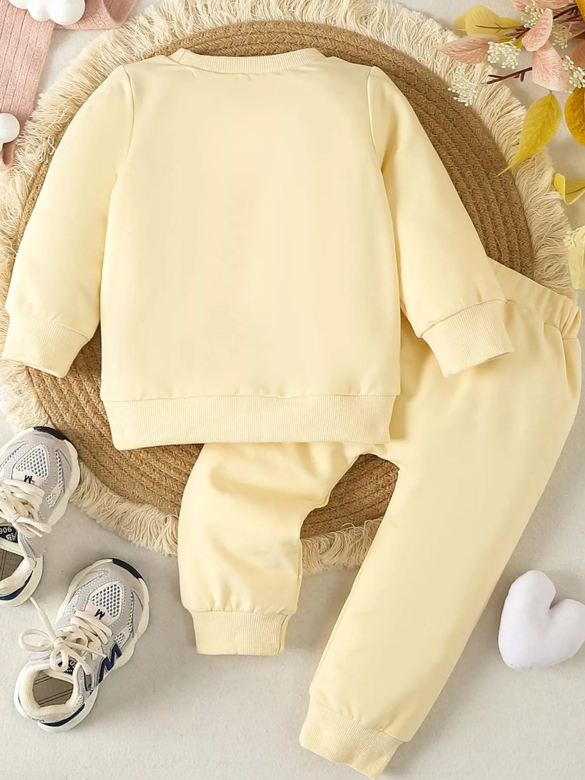 Back of the pale yellow top and pants