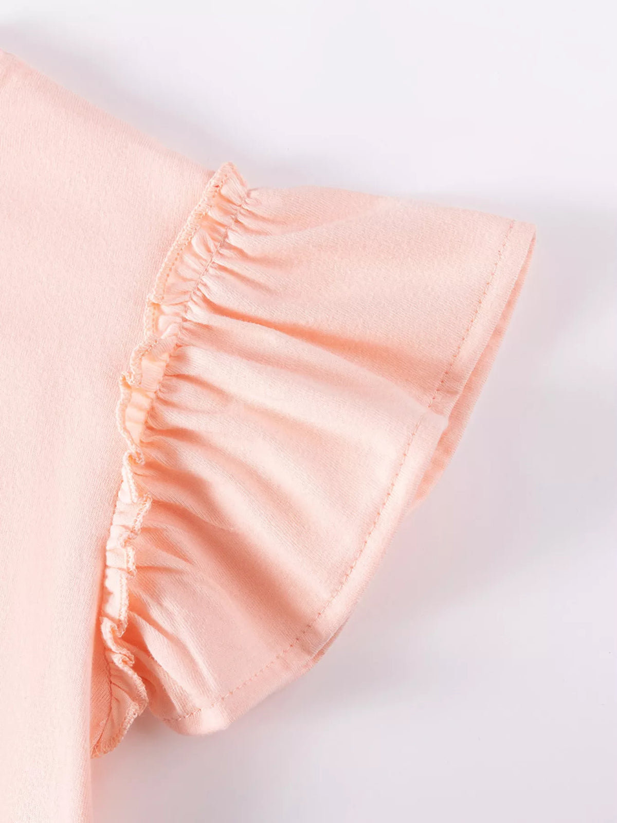 Gathered peach shoulder ruffle