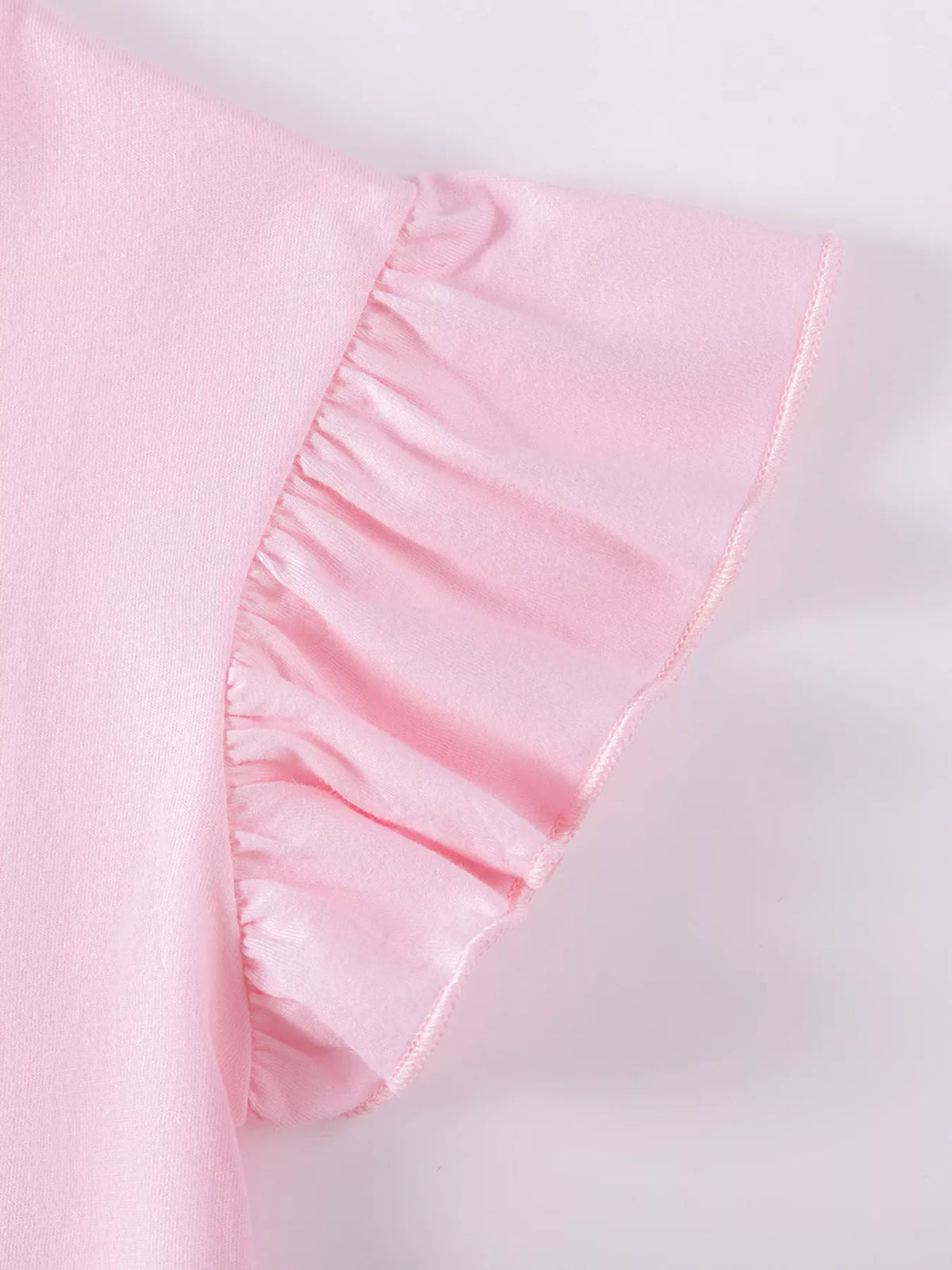 Gathered pink shoulder ruffle