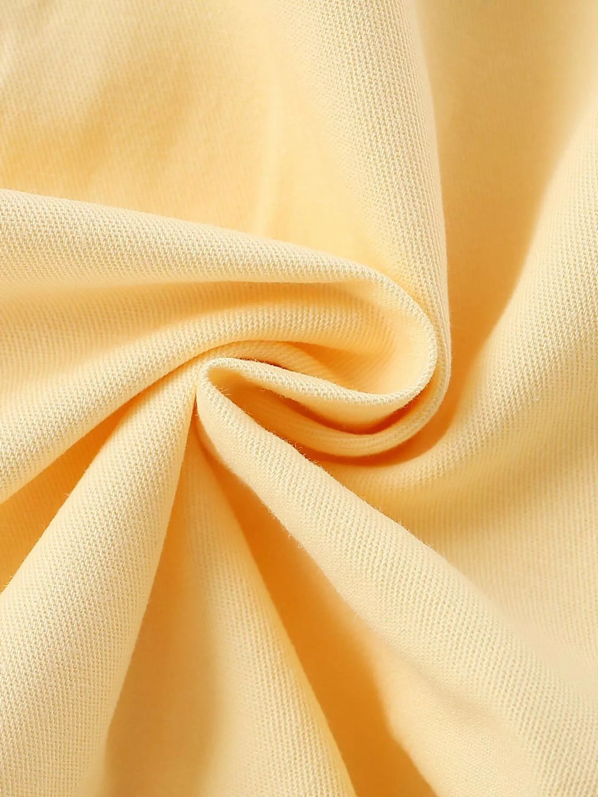 Pale yellow fabric close-up