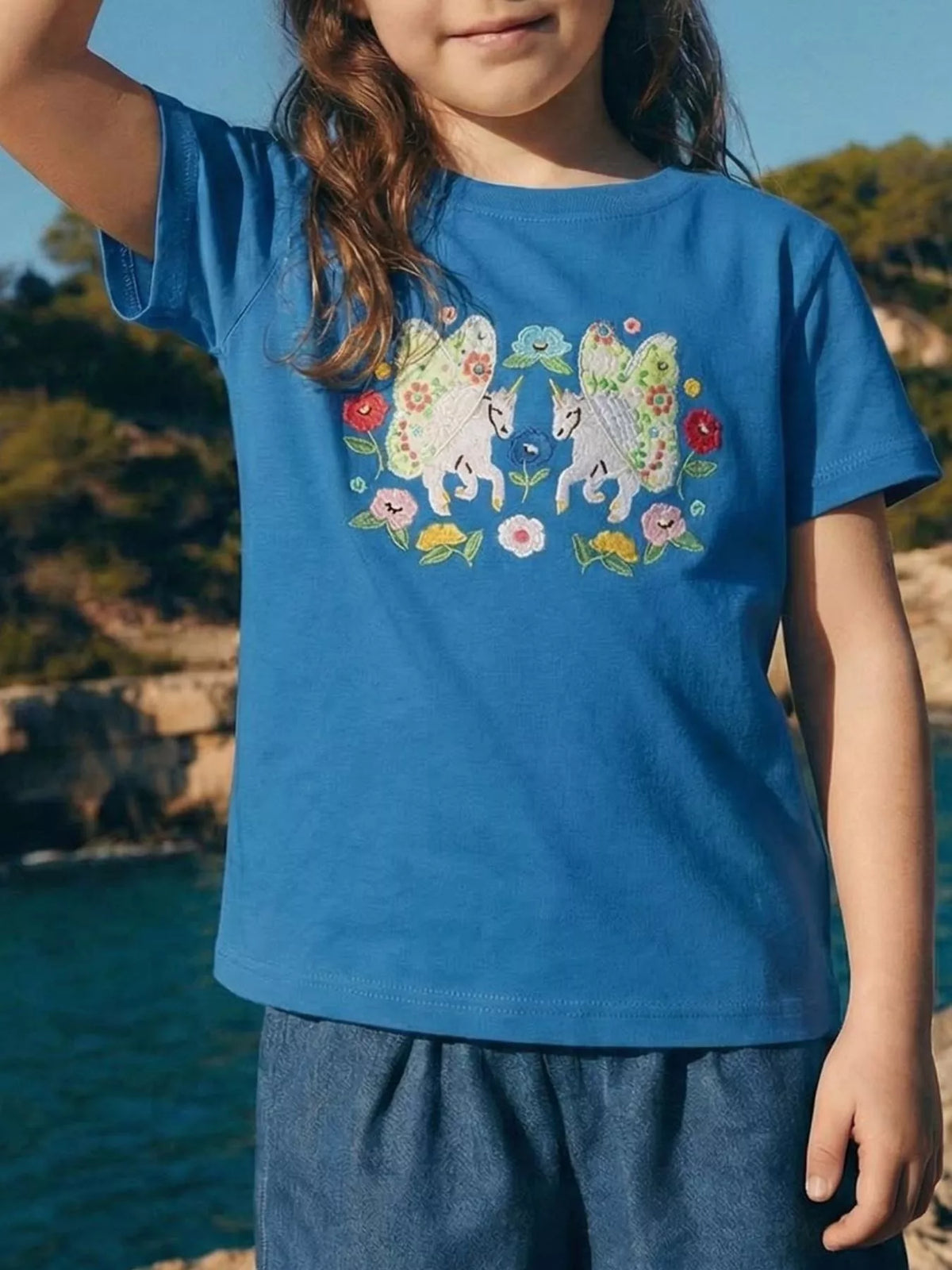 Blue Unicorn Embroidered T-Shirt — tee worn by a child
