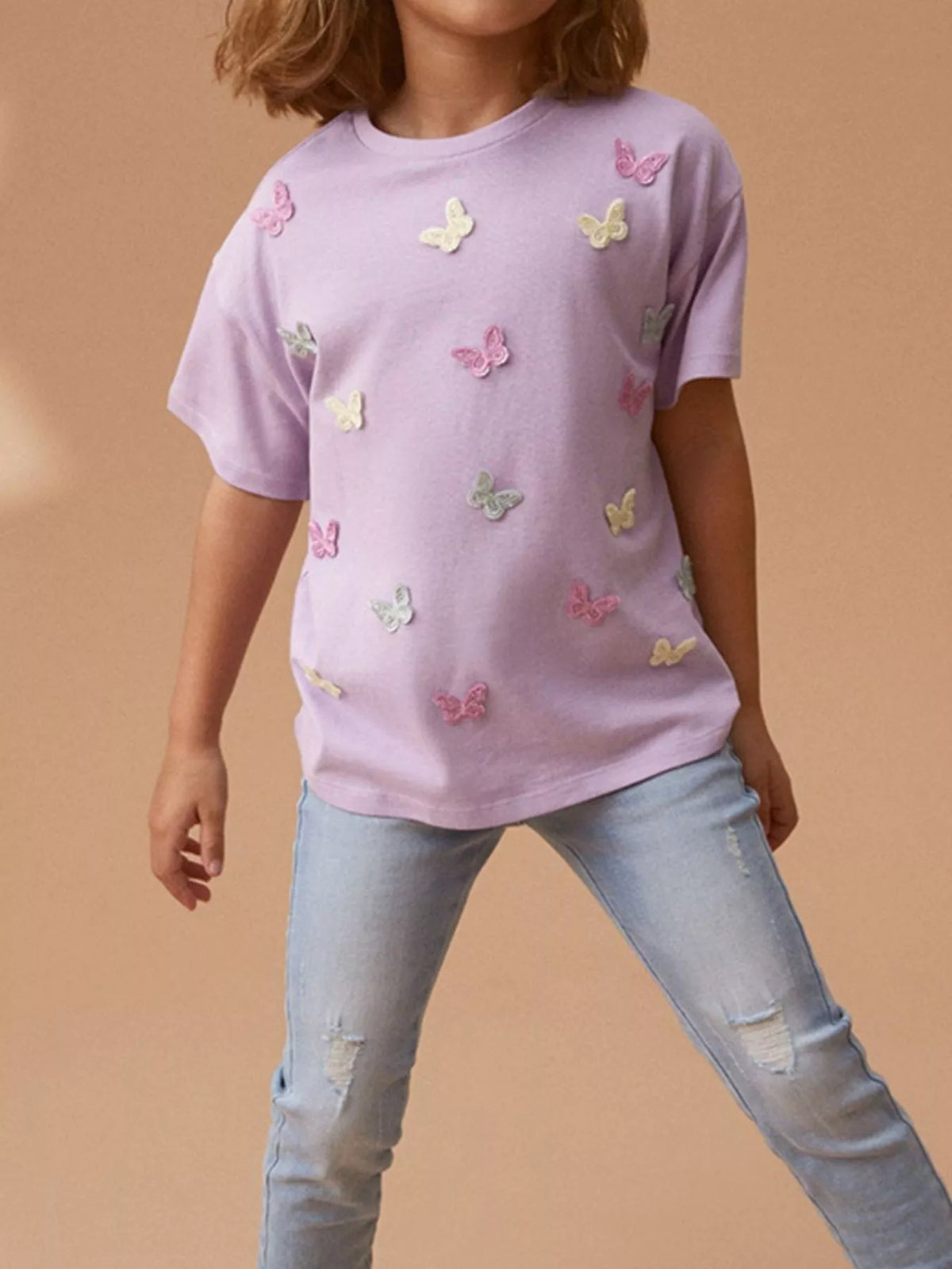 Lavender butterfly applique shirt — shirt shown on model