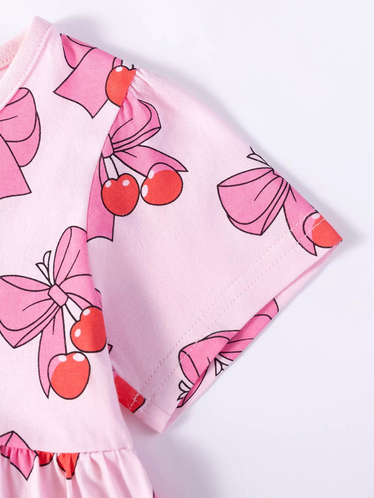 Cherry-and-bow print on the short sleeve