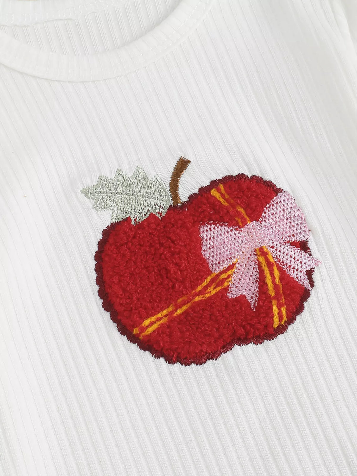 White ribbed apple bodysuit red flare pants and headband — embroidered apple and pink bow
