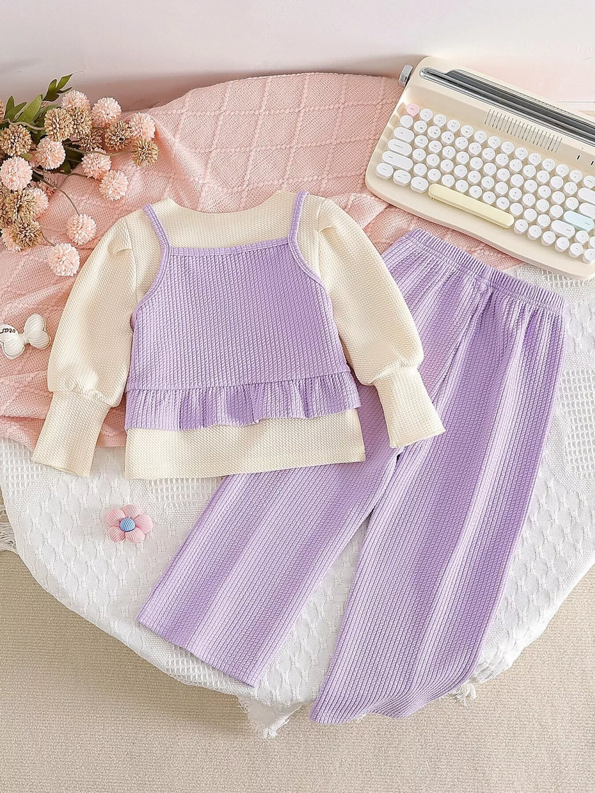 Back of the cream-and-lavender top and pants