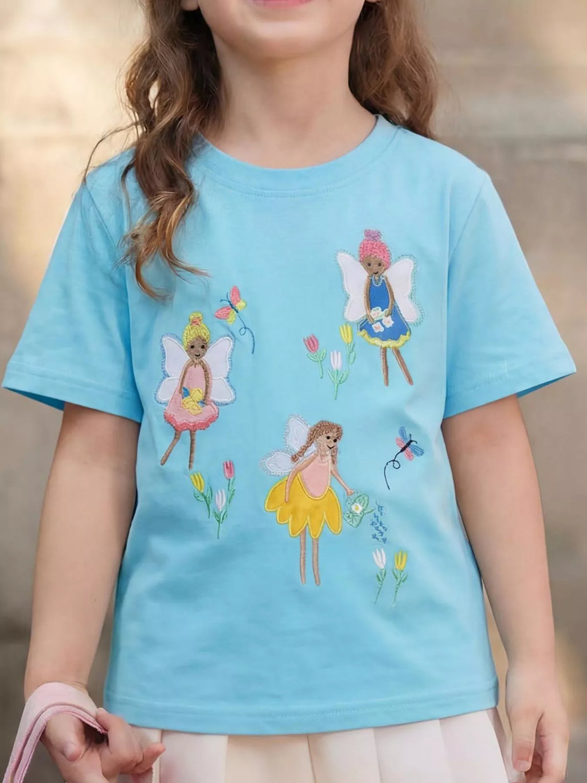 Aqua short-sleeve tee with fairy embroidery on a child