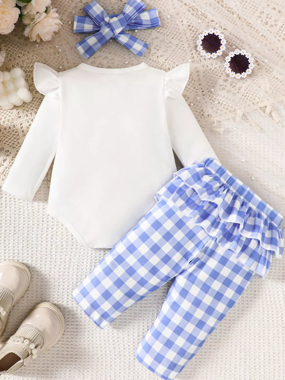 Back of the white bodysuit and blue gingham pants with headband