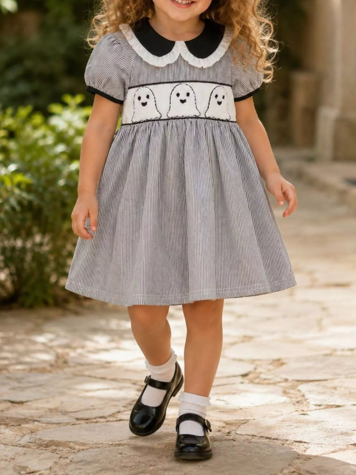 Front of the black gingham ghost dress on a child