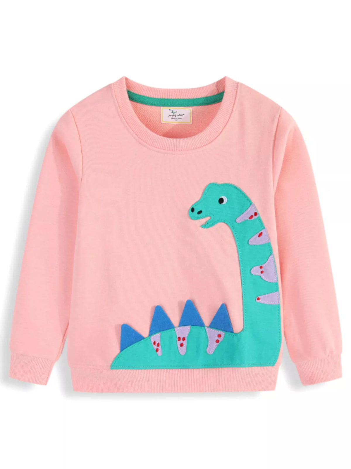 Pink dinosaur applique long sleeve top with blue spikes — front