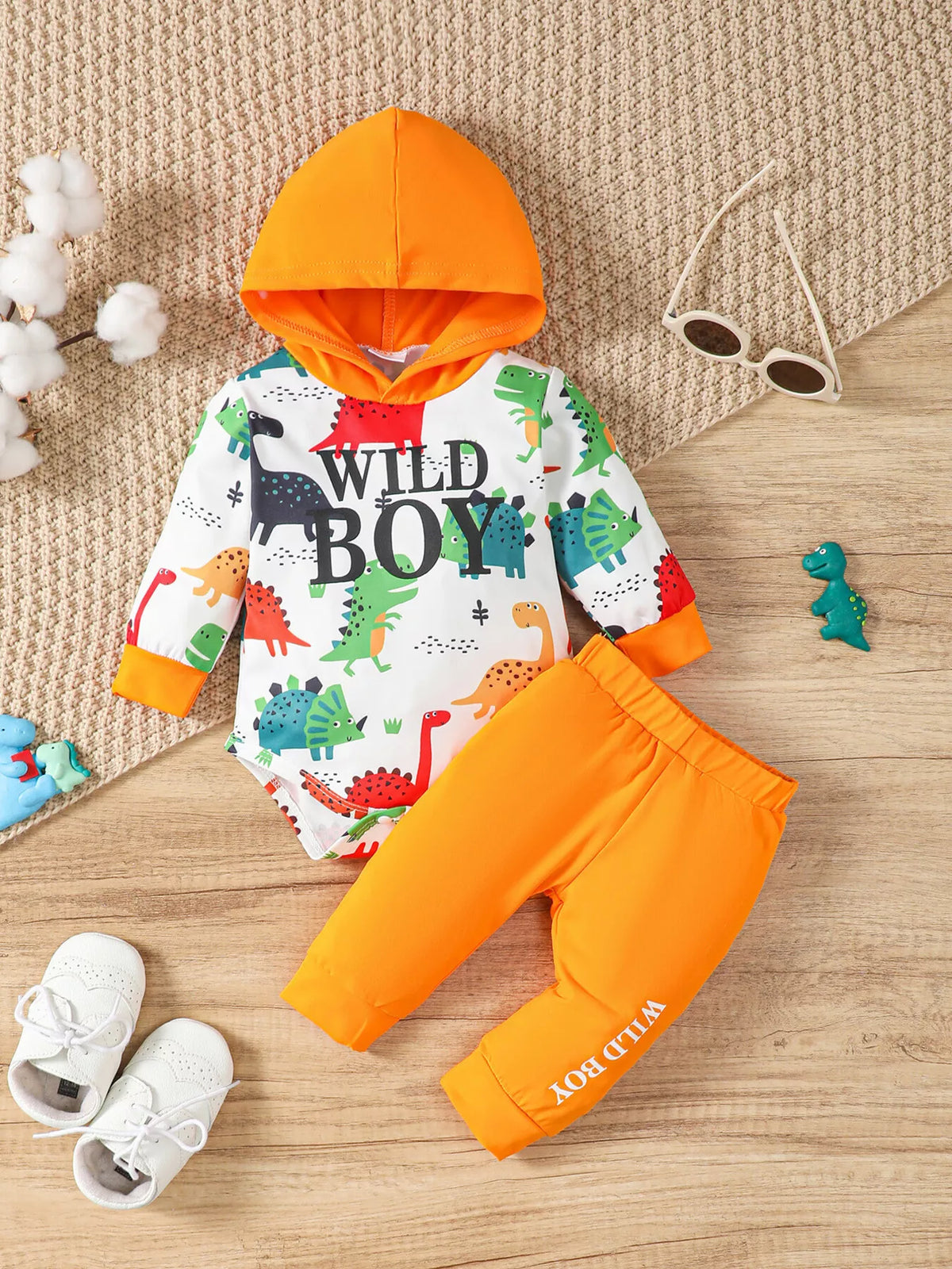 Dinosaur Wild Boy hooded bodysuit and orange pants — outfit front showing wild boy lettering