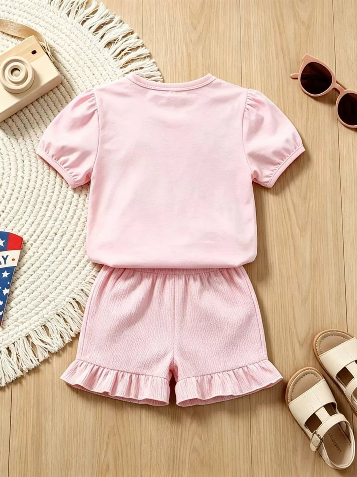 Back of the pink tee and ruffled shorts