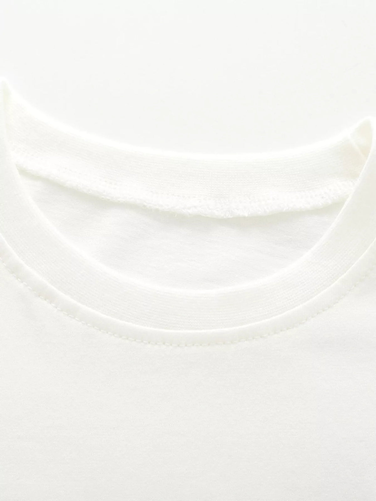 White flower applique ruffle sleeve top and green striped leggings — round neckline