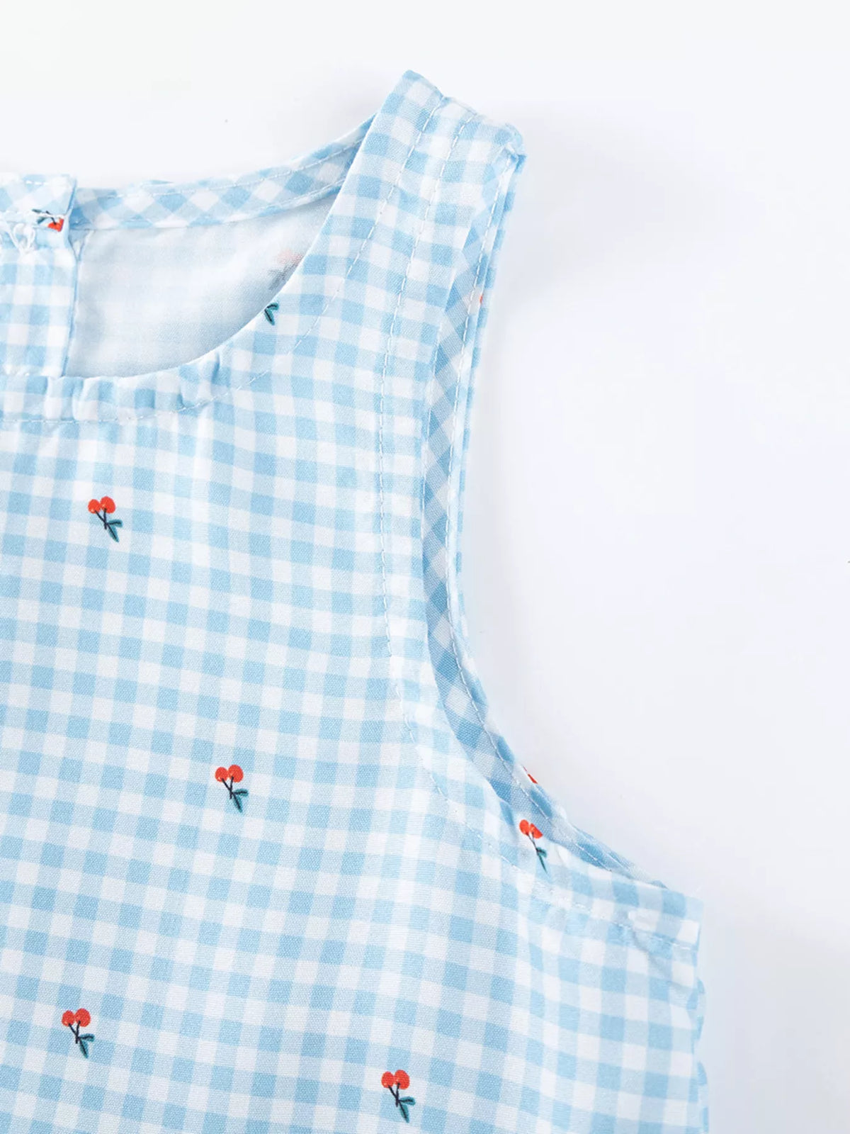 Blue Gingham Asymmetric Ruffle Dress — armhole and small embroidered detail