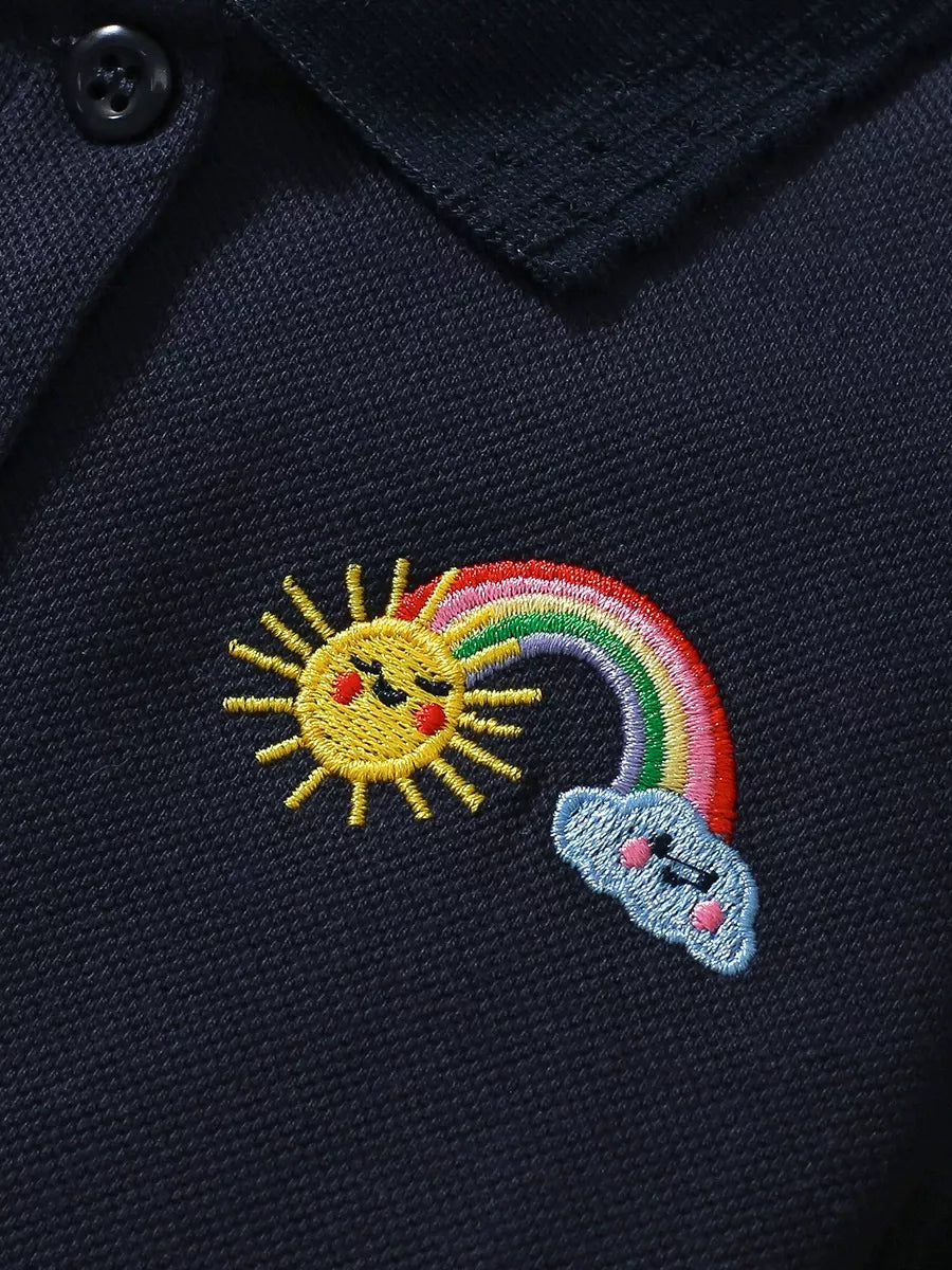 Navy Rainbow Embroidered Polo Dress — rainbow sun and cloud embroidery