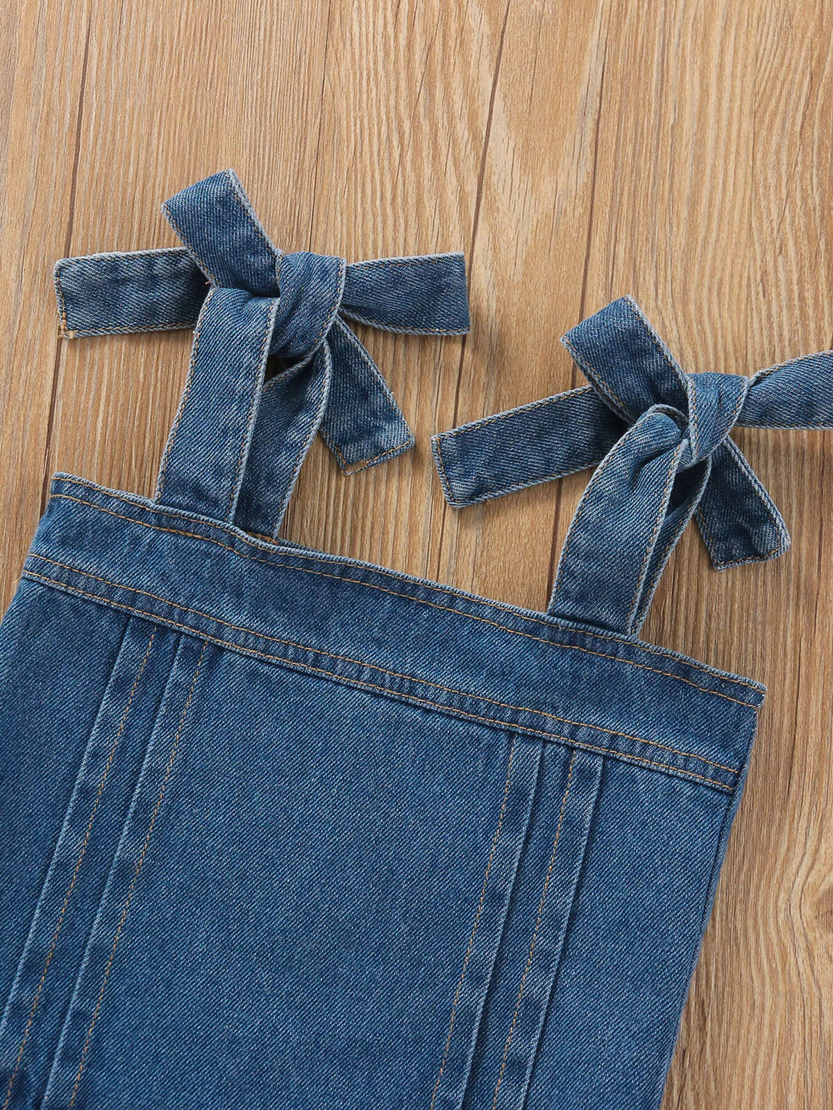 Tied denim shoulder straps and square neckline